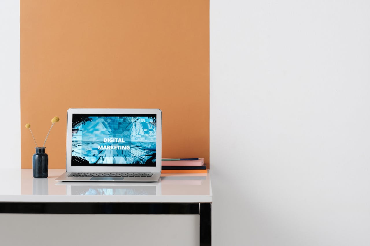 services-02 A clean, modern workspace featuring a laptop with digital marketing on screen, ideal for business use.